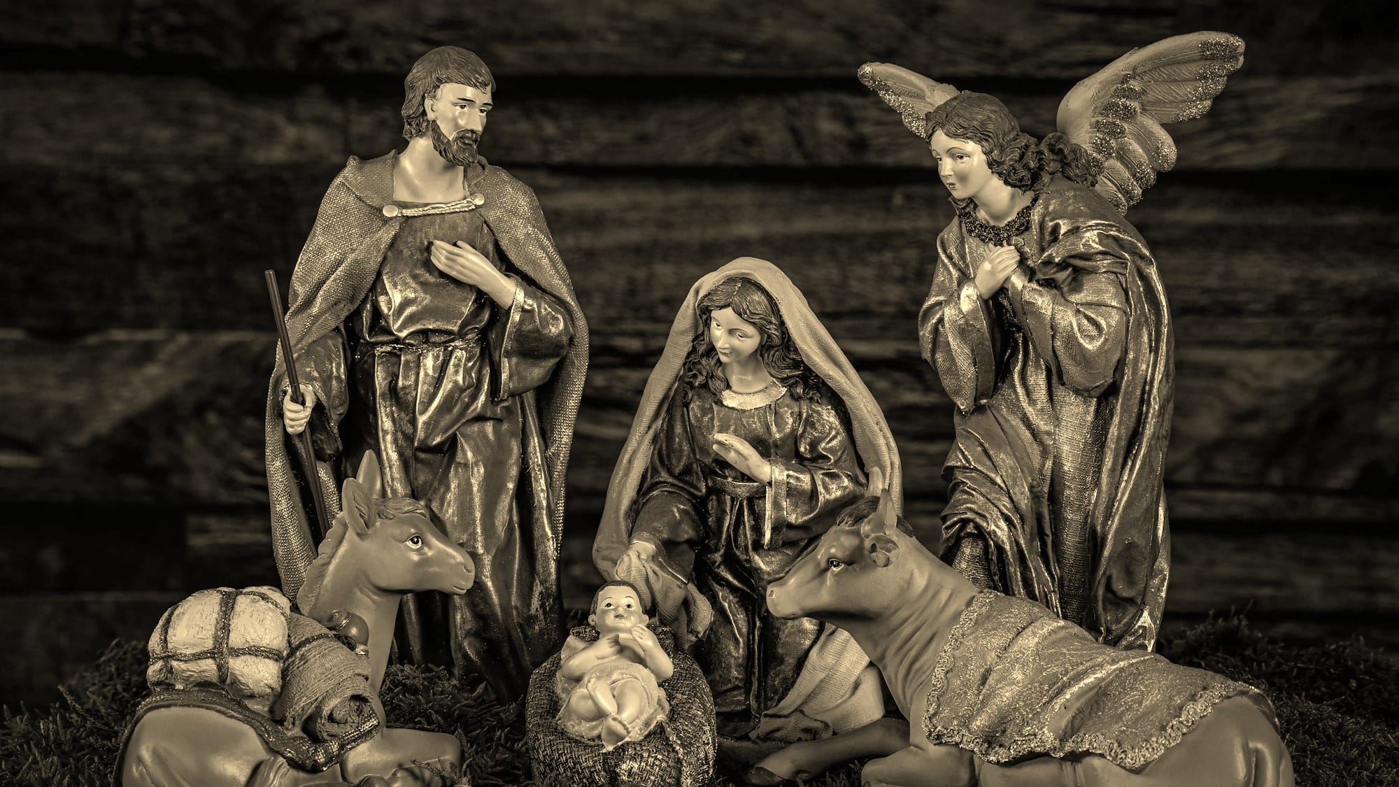 a nativity scene of three angels and a baby jesus